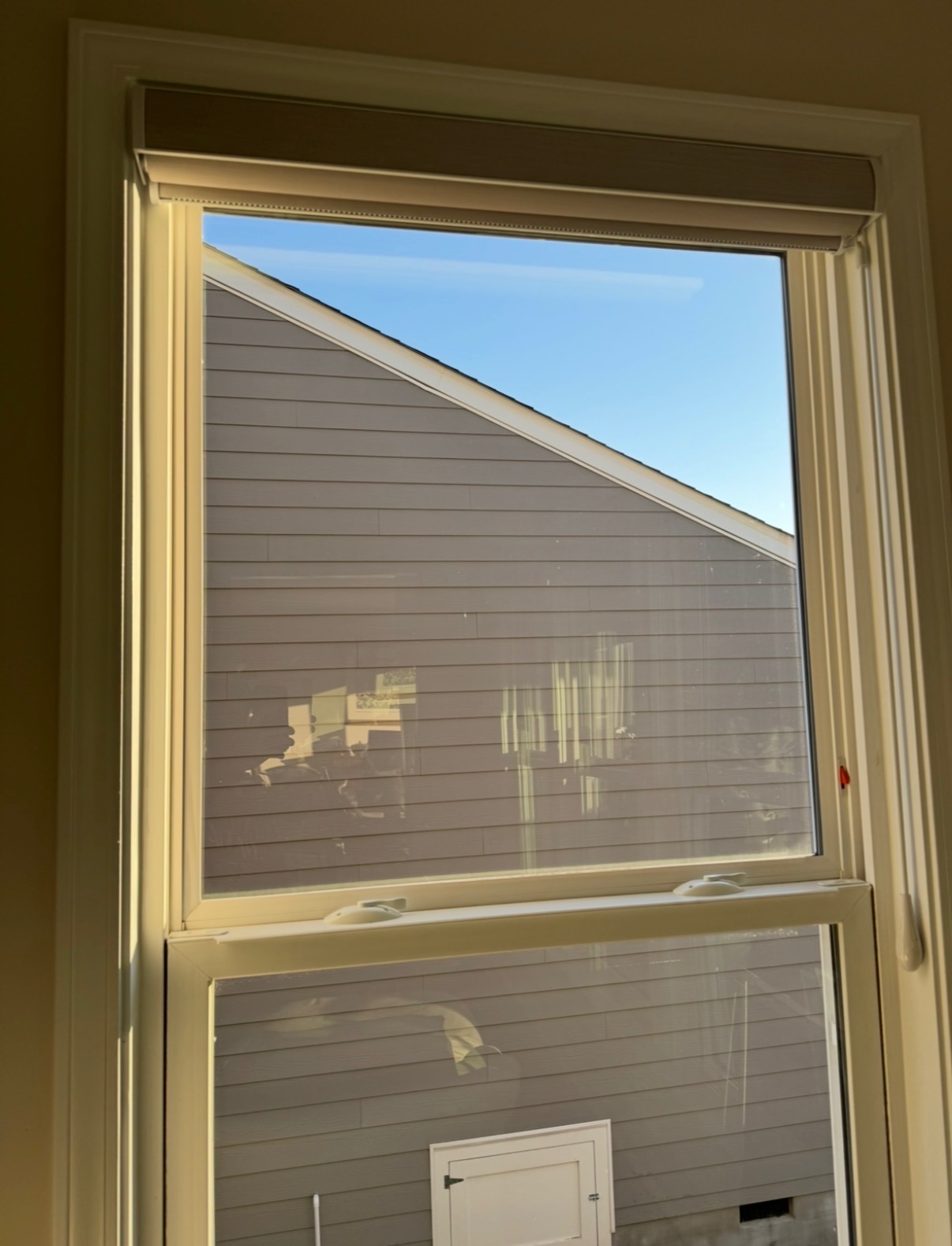 Tall window with hard water spots — after cleaning